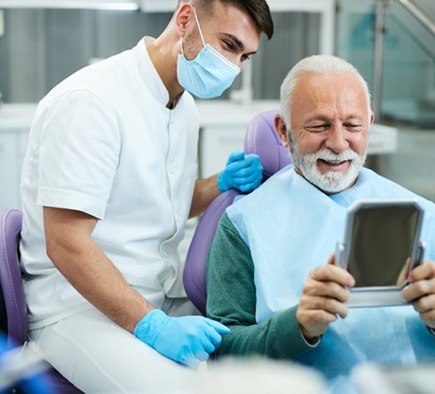 a patient visiting his dentist for dental implant care