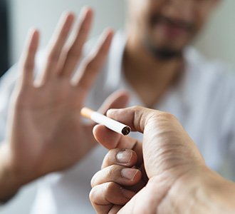 Man saying no to a cigarette